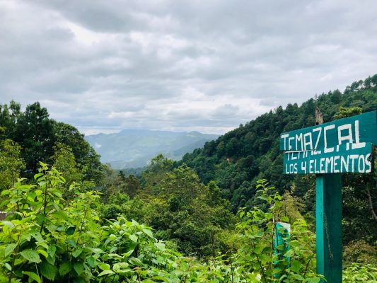 Hand-painted street sign for Temazcal los Cuatro Elementos